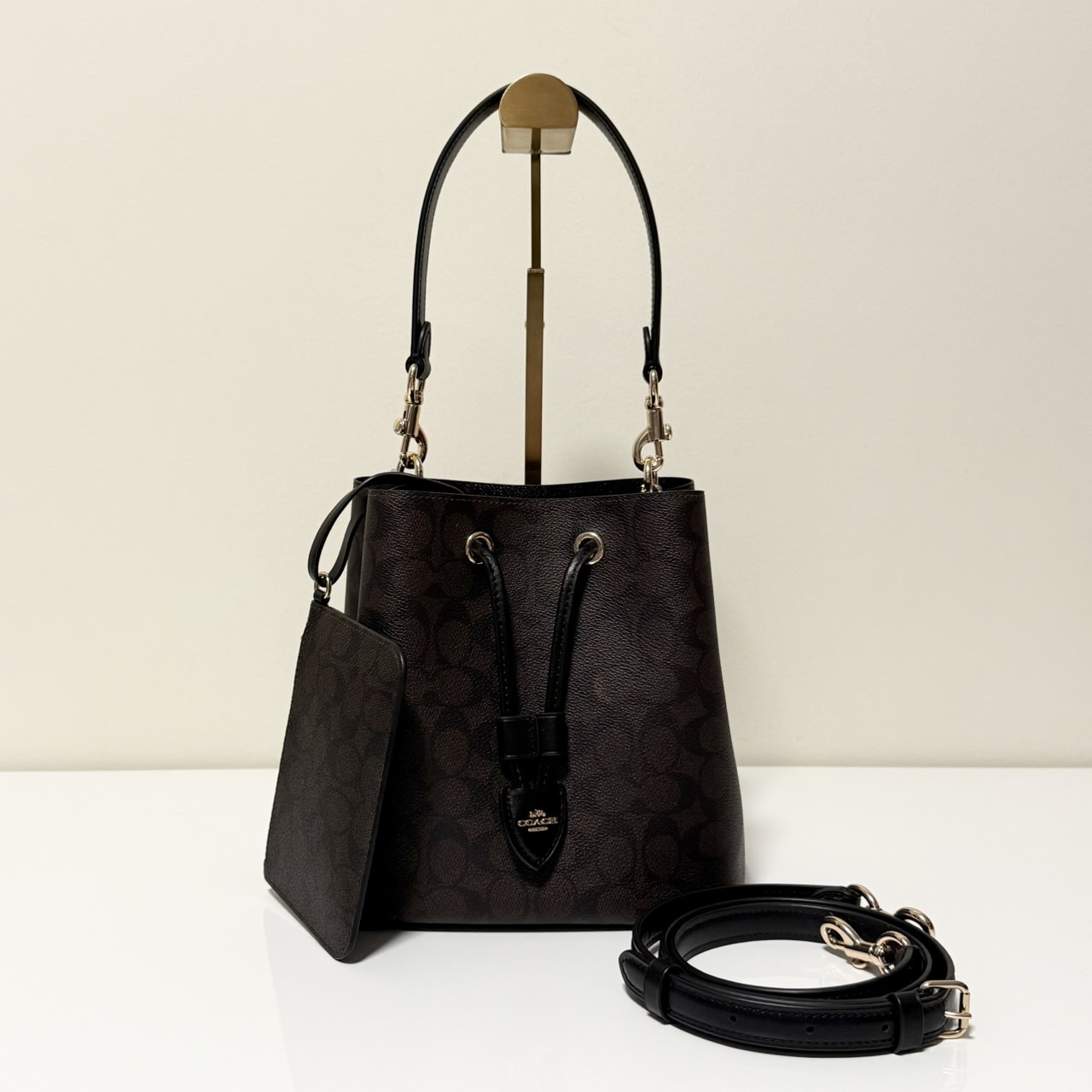 COACH ROWAN BUCKET BAG IN SIGNATURE CANVAS