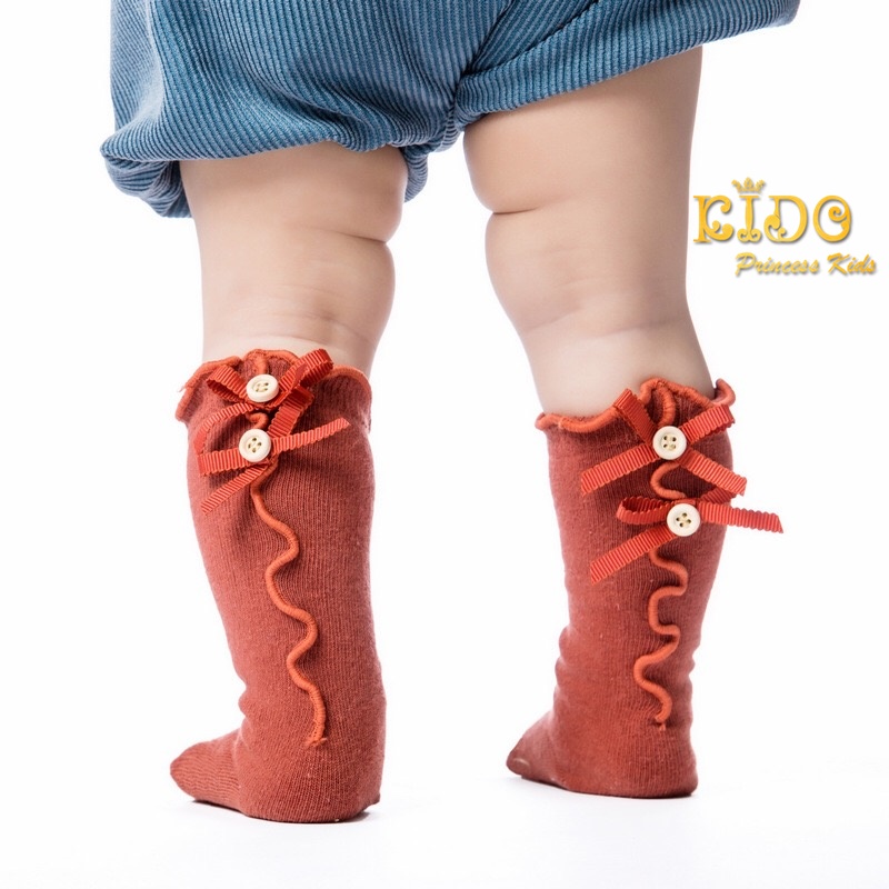 ถุงเท้าเด็ก(มีหน้าร้านอยู่รัชดา)M021 สีส้ม ยาวใต้เข่ามีโบว์กับกระดุมสองจุด