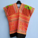 เสื้อผ้าม้ง สีชมพูอมส้ม